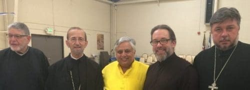 With Greek Orthodox and Russian Orthodox priests