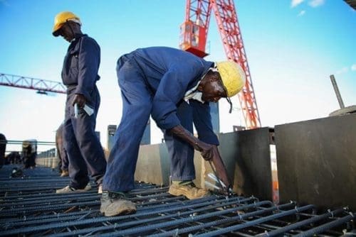 Workers work on a construction site on section six of Kenya's Standard Gauge Railway project, near Makueni, Kenya, on March 16, 2015. The project, expected to cost 3.8 billion U.S. dollars, involves the construction of about 480 kilometer railway line from the port city Mombasa to the capital city Nairobi. China Roads and Bridges Corporation (CRBC) is undertaking the project. (Xinhua/Pan Siwei) Workers work on a construction site on section six of Kenya's Standard Gauge Railway project, near Makueni, Kenya, on March 16, 2015. The project, expected to cost 3.8 billion U.S. dollars, involves the construction of about 480 kilometer railway line from the port city Mombasa to the capital city Nairobi. China Roads and Bridges Corporation (CRBC) is undertaking the project. (Xinhua/Pan Siwei)