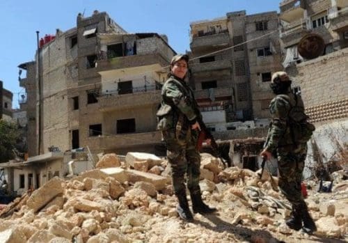 Two female snipers patrol in Daraya suburb of the capital Damascus, Syria, on April 5, 2015. The snipers are members of the female force in Syrian Republican Guards. Their unit consists of around 800 volunteer, unmarried, female fighters- aged between 20 and 24 years old. Their task is to work alongside the Syrian army in its battle against the rebels. (Xinhua/Zhang Naijie) (jl) Two female snipers patrol in Daraya suburb of the capital Damascus, Syria, on April 5, 2015. The snipers are members of the female force in Syrian Republican Guards. Their unit consists of around 800 volunteer, unmarried, female fighters- aged between 20 and 24 years old. Their task is to work alongside the Syrian army in its battle against the rebels. (Xinhua/Zhang Naijie) (jl)