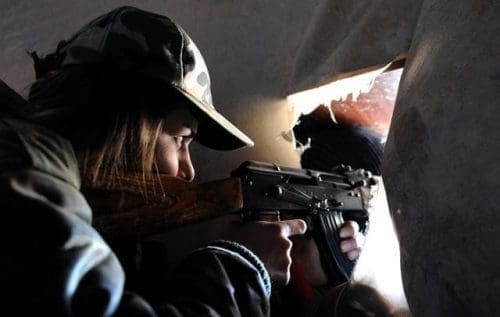 A female sniper takes positon in a buliding in Daraya suburb of the capital Damascus, Syria, on April 5, 2015. The snipers are members of the female force in Syrian Republican Guards. Their unit consists of around 800 volunteer, unmarried, female fighters- aged between 20 and 24 years old. Their task is to work alongside the Syrian army in its battle against the rebels. (Xinhua/Zhang Naijie) (jl) A female sniper takes positon in a buliding in Daraya suburb of the capital Damascus, Syria, on April 5, 2015. The snipers are members of the female force in Syrian Republican Guards. Their unit consists of around 800 volunteer, unmarried, female fighters- aged between 20 and 24 years old. Their task is to work alongside the Syrian army in its battle against the rebels. (Xinhua/Zhang Naijie) (jl)