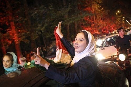 Iranians celebrate the nuclear agreement in Tehran, Iran, on July 14, 2015. The deal ushered in a new era for Iran's relations with the world. "If the deal is implemented, the wall of distrust between Iran and western powers will be gradually demolished," Iranian President Hassan Rouhani said. (Xinhua/Ahmad Halabisaz) Iranians celebrate the nuclear agreement in Tehran, Iran, on July 14, 2015. The deal ushered in a new era for Iran's relations with the world. "If the deal is implemented, the wall of distrust between Iran and western powers will be gradually demolished," Iranian President Hassan Rouhani said. (Xinhua/Ahmad Halabisaz)