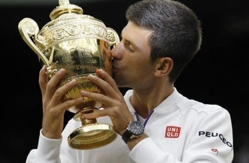 Novak Djokovic of Serbia kisses the trophy after the men's singles final with Roger Federer of Switzerland at the 2015 Wimbledon Championships in Wimbledon, southwest London, Britain on July 12, 2015. Novak Djokovic beat Roger Federer 3:1 to win the title. (Xinhua/Han Yan) Novak Djokovic of Serbia kisses the trophy after the men's singles final with Roger Federer of Switzerland at the 2015 Wimbledon Championships in Wimbledon, southwest London, Britain on July 12, 2015. Novak Djokovic beat Roger Federer 3:1 to win the title. (Xinhua/Han Yan)