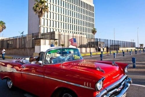 A tourist from California waves a U.S. national flag inside a vintage American car near the U.S. Embassy in Havana, Cuba, on July 20, 2015. Cuba and the United States reopened their respective embassies on July 20 as part of their recent agreement to restore diplomatic relations. (Xinhua/Liu Bin) A tourist from California waves a U.S. national flag inside a vintage American car near the U.S. Embassy in Havana, Cuba, on July 20, 2015. Cuba and the United States reopened their respective embassies on July 20 as part of their recent agreement to restore diplomatic relations. (Xinhua/Liu Bin)