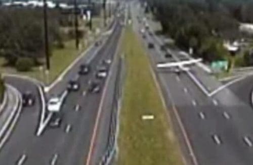 wpid-plane-landign-highway.jpg