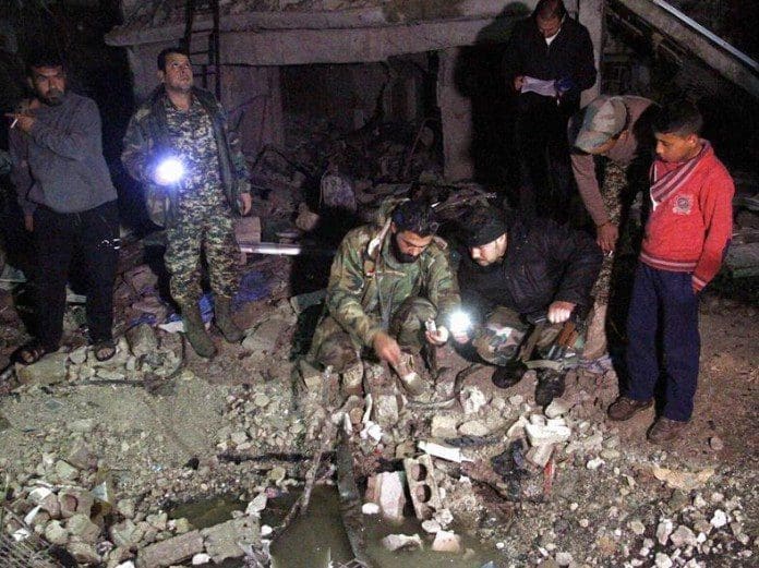 Syrian army soldiers inspect the site of a series of attacks in the district of Sayyidah Zaynab, south of Damascus, Syria, Feb. 21, 2016. The death toll in the triple bombings that rocked a Shiite district in Damascus on Sunday has risen to 83, state news agency SANA said. As many as 178 others were injured in these serial attacks. [Xinhua/Yang Zhen]