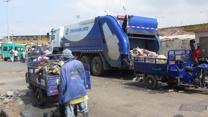 Zoomlion and AMA workers collecting filth at the Tema Station. Zoomlion and AMA workers collecting filth at the Tema Station.
