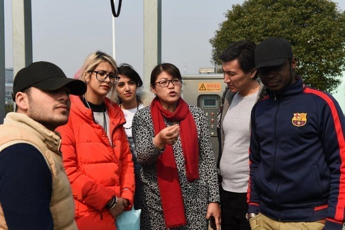 Overseas students from Russia, Iran and Jordan of Yiwu Industrial &Commercial College visited Yiwu sewage disposal center to learn about the process and technology of sewage treatment on Feb. 27, 2017. (Photo by People’s Daily)