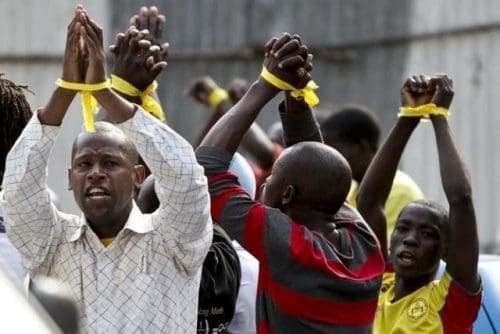 Members of the Patriotic Youth of Angola protest against irregularities in the election process