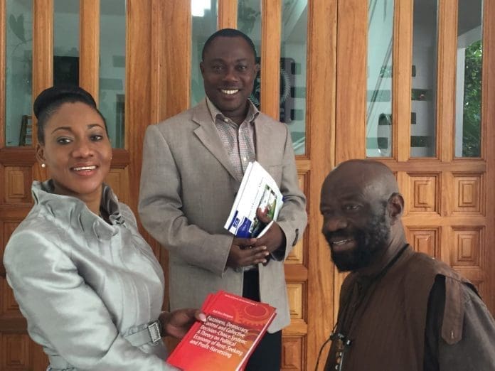 Prof. Kofi Kissi Dompere, seated right, with Mrs. Jean Mensa, Executive Director of the Institute of Economic Affairs (IEA) and Dr. Ransford Gyampo, Research Fellow (IEA).