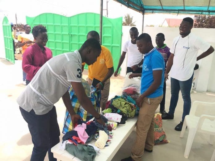 NABA LIFE FOUNDATION team members setting up the cloths to present