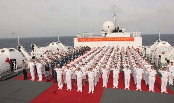 A flag-raising and oath-taking ceremony is held on Chinese naval hospital ship Peace Ark on August 1, 2017. (Photo from People’s Daily Online)