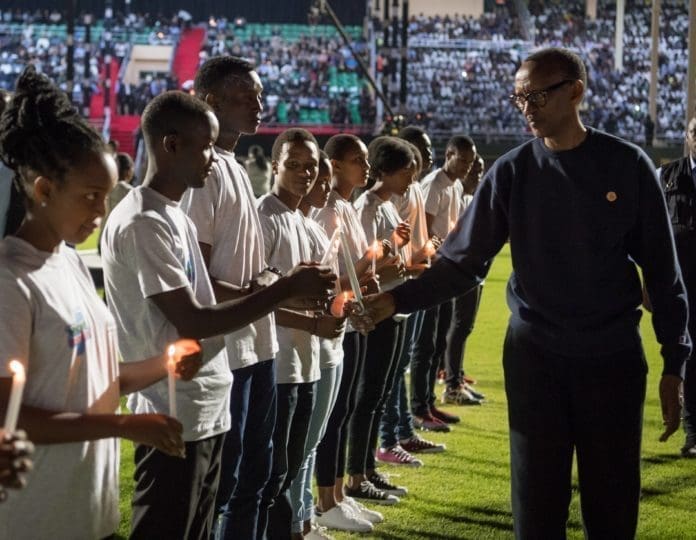 A young Rwandan lights the candle for Rwandan President Paul Kagame at a night vigil to commemorate the 25th anniversary of the 1994 Rwandan genocide against Tutsi, in Kigali, capital of Rwanda, on April 7, 2019. Rwandans on Sunday started the commemoration to mark the 25th anniversary of the 1994 genocide that left over 1 million people dead, mainly ethnic Tutsis, with President Pual Kagame calling for continued efforts to transform the country. (Xinhua/Office of the President of Rwanda)