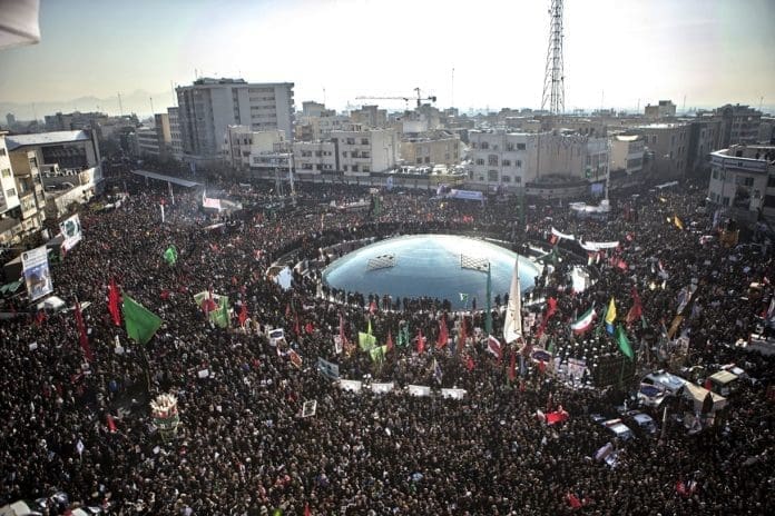 People attend the funeral ceremony of Iranian general Qassem Soleimani in Tehran, Iran, Jan. 6, 2020. Hundreds of thousands of Iranians in Tehran on Monday mourned the assassination of Qassem Soleimani. (Photo by Ahmad Halabisaz/Xinhua)
