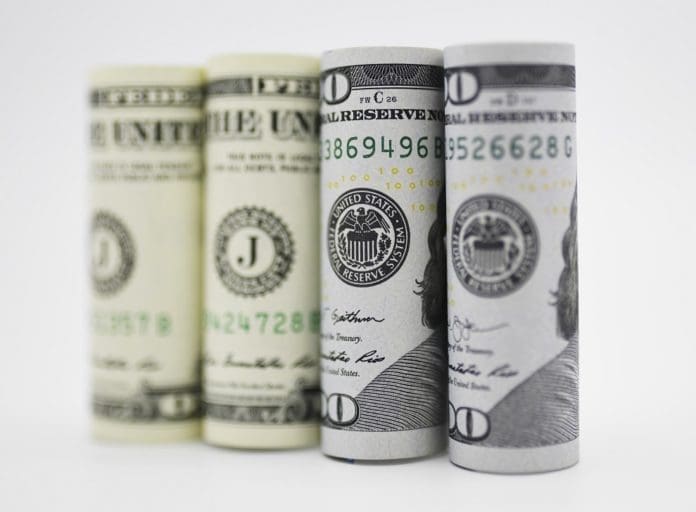 Photo taken on Sept. 18, 2019 shows U.S. dollar banknotes in Washington D.C., the United States. U.S. Federal Reserve on Wednesday lowered interest rates by 25 basis points amid growing risks and uncertainties stemming from trade tensions and a global economic slowdown, following a rate cut in July that was its first in more a decade. (Xinhua/Liu Jie)