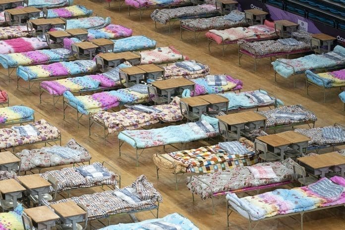Photo taken on Feb. 4, 2020 shows an interior view of the Hongshan Gymnasium in Wuhan, central China's Hubei Province. Wuhan in central China's Hubei Province started converting three existing venues, including a gymnasium and an exhibition center, into hospitals to receive patients infected with the novel coronavirus (2019-nCoV), the headquarters for the epidemic control said late Monday. (Xinhua/Xiong Qi)