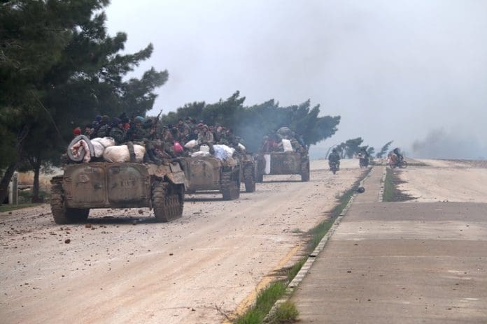 Syrian soldiers are seen on the Damascus-Aleppo highway near the administrative border of Aleppo province, Syria, on Feb. 12, 2020. For the first time since 2012, the Syrian army wrested control of the strategic Damascus-Aleppo highway following battles against the rebel groups, a war monitor reported on Tuesday. (Str/Xinhua)