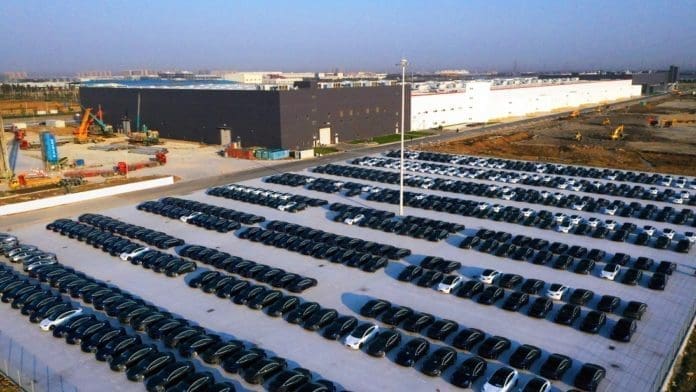 The aerial photo taken on Dec. 7, 2019 shows Model 3 sedans parked at the gigafactory of Tesla in the Lingang new area in Shanghai. Photo by People’s Daily Online