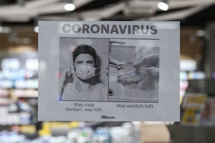 A poster calling on more hand washing instead of purchasing masks is seen at a pharmacy in Berlin, capital of Germany, March 3, 2020. Germany's confirmed cases of COVID-19 have increased to 188 on Tuesday from 150 a day earlier, according to Robert Koch Institute (RKI), a federal government agency and research institute responsible for disease control and prevention. (Xinhua/Shan Yuqi)