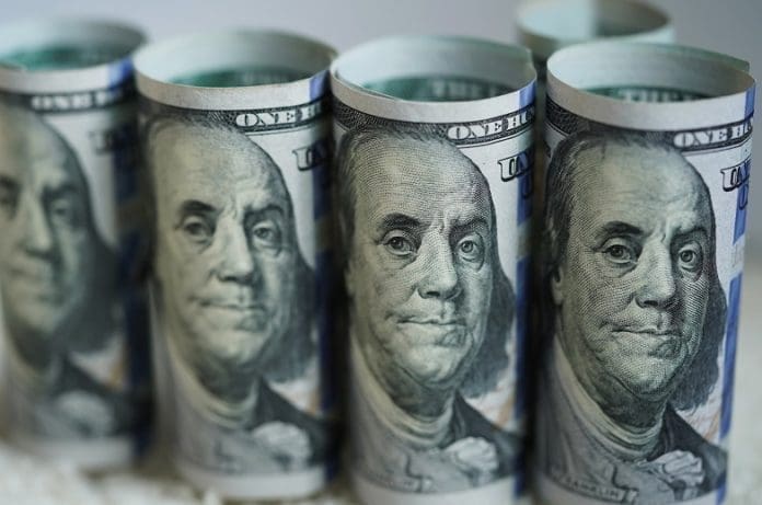 Photo taken on March 19, 2020 shows U.S. dollar banknotes in Washington D.C., the United States. The Trump administration's plan to send Americans relief money as part of a massive stimulus package in response to COVID-19 could be 1,000 U.S. dollars per person, and 500 dollars per child, Treasury Secretary Steven Mnuchin said Thursday. (Xinhua/Liu Jie)