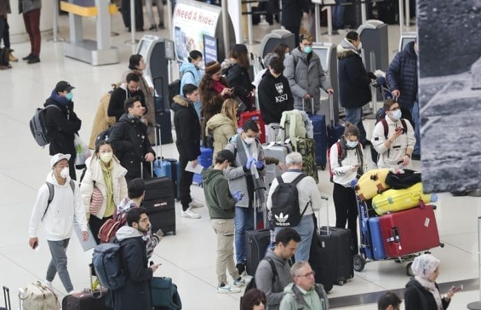Passengers wait to depart at John F. Kennedy International Airport in New York, the United States, March 13, 2020. The United States implemented the restrictions which suspend all travel from European countries except Britain for 30 days in a measure faced with further spread of the COVID-19 Friday at midnight. U.S. President Donald Trump on Friday declared a national emergency to open up 50 billion U.S. dollars in federal aid to help combat the spread of COVID-19 across the country. (Xinhua/Wang Ying)