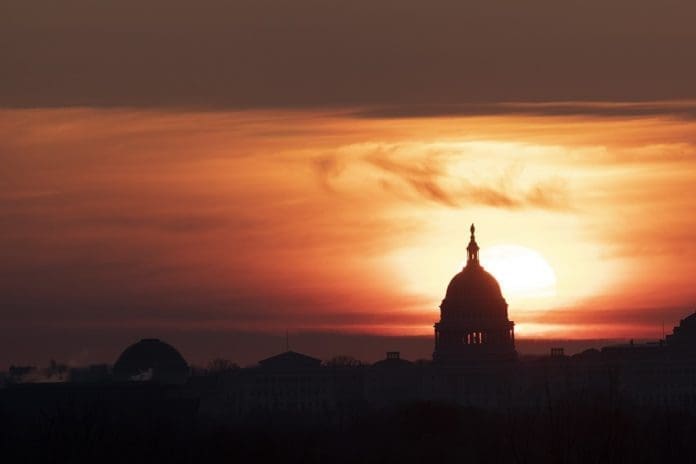The U.S. Capitol Building is silhouetted against sunrise in Washington D.C., the United States, on March 18, 2020. U.S. President Donald Trump said on Wednesday he will invoke the Defense Production Act, which allows the administration to force American industry to ramp up production of medical supplies, to combat the COVID-19 pandemic. (Xinhua/Liu Jie) The U.S. Capitol Building is silhouetted against sunrise in Washington D.C., the United States, on March 18, 2020. U.S. President Donald Trump said on Wednesday he will invoke the Defense Production Act, which allows the administration to force American industry to ramp up production of medical supplies, to combat the COVID-19 pandemic. (Xinhua/Liu Jie)