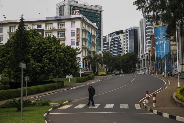 A pedestrian crosses a road in downtown Kigali, Rwanda, on March 22, 2020. On Saturday, Rwanda announced stricter measures to be implemented for the next two weeks in a bid to contain the spread of coronavirus, banning unnecessary movements of residents and ordering border closure. (Photo by Cyril Ndegeya/Xinhua)