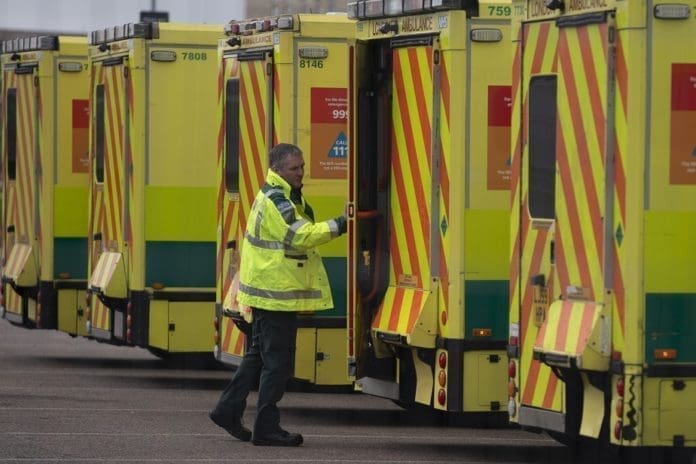 NHS Ambulance staff outside the ExCel Center in London, Britain in, 29 March 2020. The Excel Center is to be used as a makeshift hospital from next week. According to news reports the NHS is anticipating a Coronavirus 'tsunami' as the peak of infarction rates nears. British Prime Minister Boris Johnson has announced that Britons can only leave their homes for essential reasons or may be fined, in order to reduce the spread of the Coronavirus. EPA/WILL OLIVER