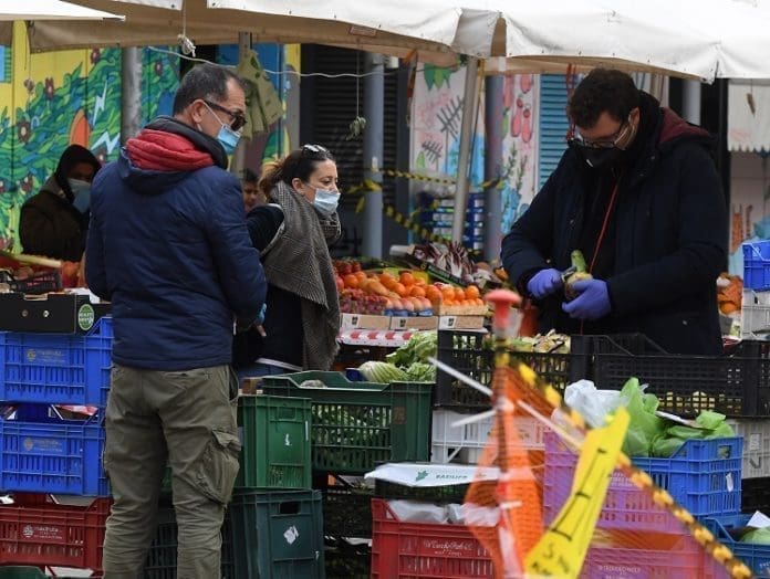 People wearing face masks shop for food at a market in Rome, Italy, on April 2, 2020. The number of confirmed COVID-19 cases worldwide has risen above 1 million, according to a new tally from Johns Hopkins University on Thursday. (Photo by Elisa Lingria/Xinhua) People wearing face masks shop for food at a market in Rome, Italy, on April 2, 2020. The number of confirmed COVID-19 cases worldwide has risen above 1 million, according to a new tally from Johns Hopkins University on Thursday. (Photo by Elisa Lingria/Xinhua)