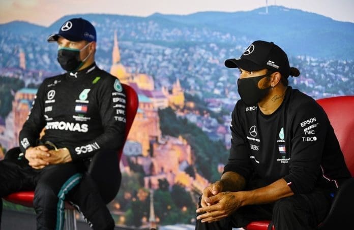 Formula One F1 - Hungarian Grand Prix - Hungaroring, Budapest, Hungary - July 18, 2020 Mercedes' Lewis Hamilton and Valtteri Bottas wear face masks during the post qualifying press conference FIA/Handout via REUTERS ATTENTION EDITORS - THIS IMAGE HAS BEEN SUPPLIED BY A THIRD PARTY. NO RESALES. NO ARCHIVES