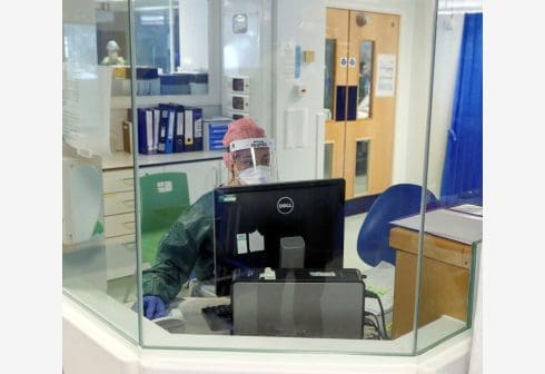 A physiotherapist sits at a workstation in an Intensive Care ward treating COVID-19 patients at Frimley Park Hospital in Surrey, Britain, May 22, 2020. Picture taken May 22, 2020. Steve Parsons/Pool via REUTERS A physiotherapist sits at a workstation in an Intensive Care ward treating COVID-19 patients at Frimley Park Hospital in Surrey, Britain, May 22, 2020. Picture taken May 22, 2020. Steve Parsons/Pool via REUTERS