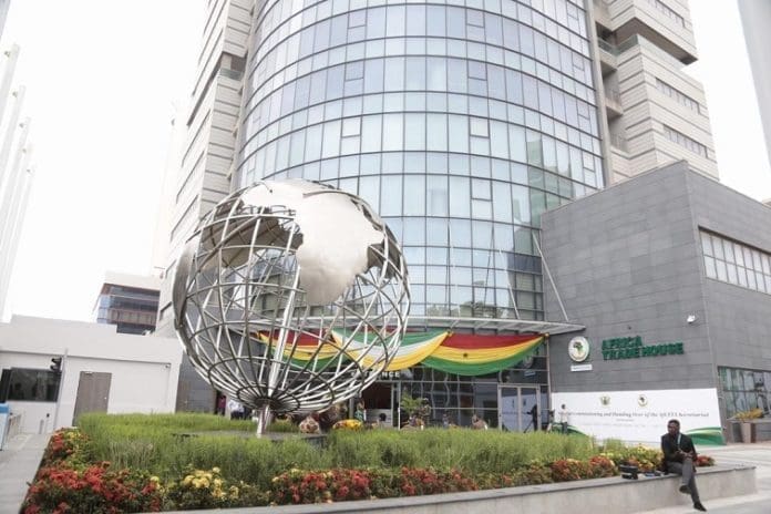 A man sits outside the African Continental Free Trade Area (AfCFTA) Secretariat office in Accra, capital of Ghana, August 17, 2020. Ghanaian President on Monday handed over the edifice housing the African Continental Free Trade Area (AfCFTA) secretariat to the African Union (AU) for the commencement of work. (Ghana Presidency/Handout via Xinhua)