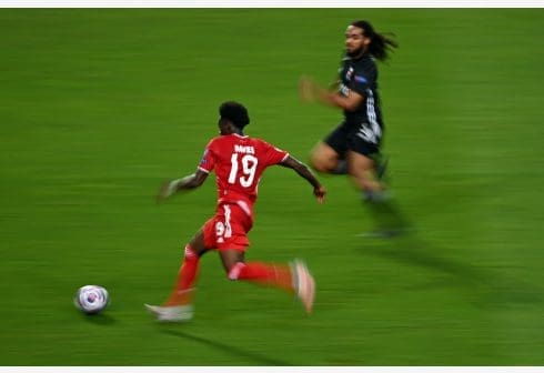 Alphonso Davies(Front) of Bayern Munich runs with the ball during the UEFA Champions League Semi Final match between Olympique Lyonnais and Bayern Munich at Estadio Jose Alvalade in Lisbon, Portugal on Aug. 19, 2020. (Photo by Michael Regan/UEFA via Xinhua) Alphonso Davies(Front) of Bayern Munich runs with the ball during the UEFA Champions League Semi Final match between Olympique Lyonnais and Bayern Munich at Estadio Jose Alvalade in Lisbon, Portugal on Aug. 19, 2020. (Photo by Michael Regan/UEFA via Xinhua)