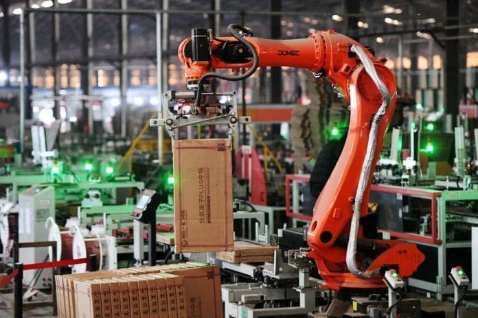 A robotic arm picks up a package of products on the automatic intelligent production line of Xinjingxiang Ceramics Co., Ltd. in Gao’an city, east China’s Jiangxi province, Dec. 10. (Photo by Zhou Liang/People’s Daily Online) A robotic arm picks up a package of products on the automatic intelligent production line of Xinjingxiang Ceramics Co., Ltd. in Gao’an city, east China’s Jiangxi province, Dec. 10. (Photo by Zhou Liang/People’s Daily Online)