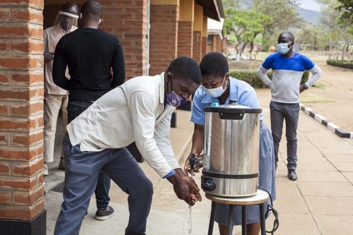 Students wash hands at school in Phalombe, Malawi, Oct. 13, 2020. The number of confirmed COVID-19 cases in the African continent has surpassed 2 million, the Africa Centers for Disease Control and Prevention (Africa CDC) said on Thursday. The latest figures from the continental disease control and prevention agency showed that a total of 2,013,388 cases were reported across the continent with the death toll related to the pandemic standing at 48,408 as of Thursday morning. (Photo by Joseph Mizere/Xinhua)
