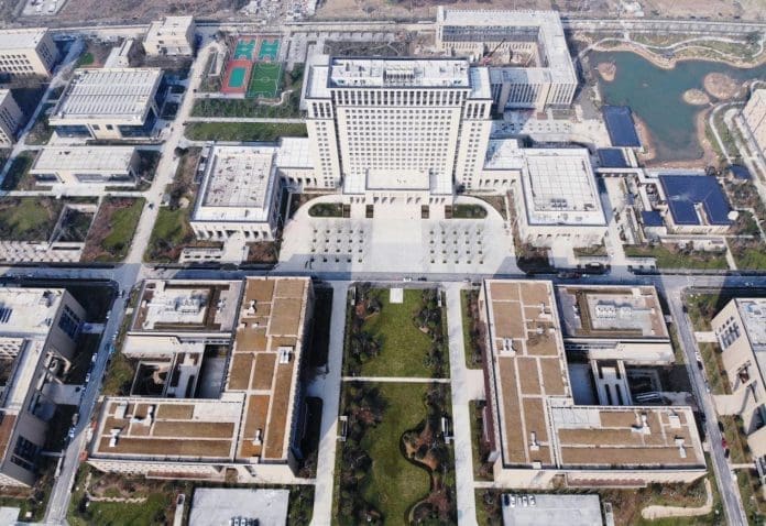 Photo taken on Dec. 21, 2020, shows an aerial view of the phase-one scientific research base of Zhejiang Lab in Yuhang district, Hangzhou, capital of east China’s Zhejiang province. The research base includes an administrative building, a big data center, a network research institute, an intelligent robot research center, and etc. (Photo by Long Wei/People’s Daily Online)
