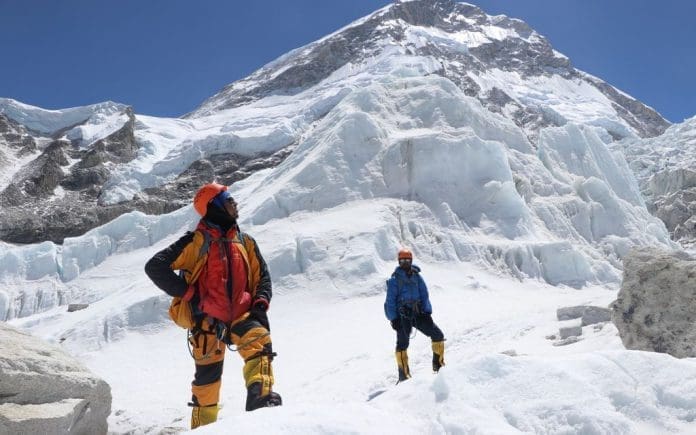 FILED - Khim Lal Gautam (left) looks up the path on the ascent to Mount Everest in 2019. A team of climbers belonging to Bahrain's Royal Guard have arrived in Nepal for the spring expedition of Mount Everest, authorities said on Tuesday, the first arrivals since 2019. Photo: Tshiring Jangbu Sherp/privat/dpa - ATTENTION: editorial use only in connection with the latest coverage and only if the credit mentioned above is referenced in full