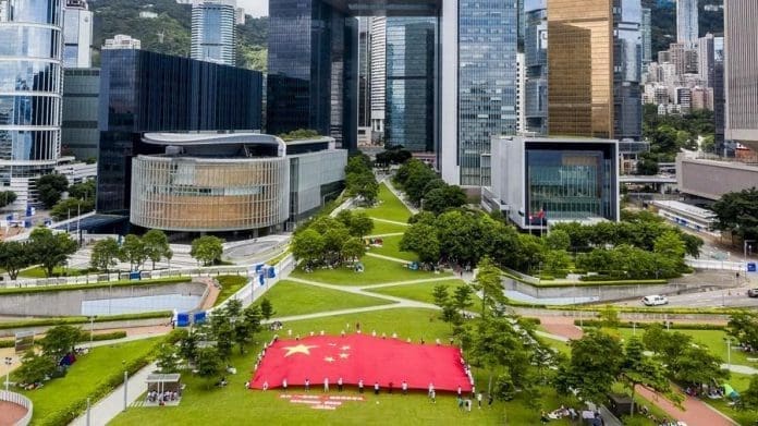 Pic: Hong Kong residents display China's national flag in the Tamar Park, Hong Kong on June 25, 2020 in support of the national security legislation for Hong Kong Special Administrative Region. (Xinhua)