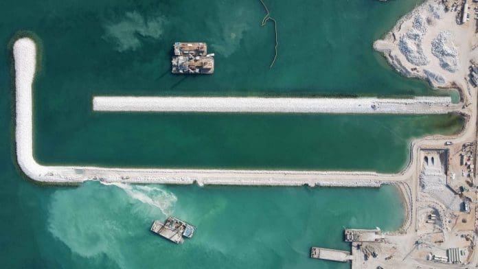 Photo taken on April 22, 2021, shows an aerial view of the construction site of a seawater desalination project in the Emirate of Umm Al Quwain, one of the seven constituent emirates in the United Arab Emirates. Undertaken by China Gezhouba Group Company Ltd., the project is the world’s second largest seawater desalination project that employs reverse osmosis technology. (Photo/Courtesy of China Gezhouba Group Company Ltd.)