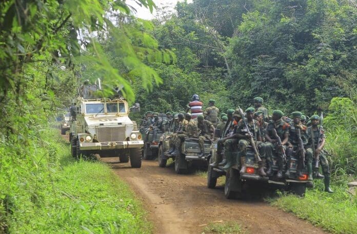 Congolese Defense Forces soldiers and United Nation forces patrol Beni, North Kivu, Democratic Republic of Congo on Friday, July 23, 2021. The government accuses Rwandan troop of incursions in the area. (AP Photo/Al-hadji Kudra Maliro)