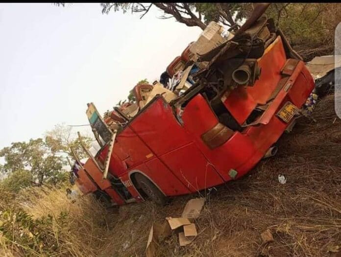 The accident bus at the accident scene with some of the dead and injured persons lying on the ground
