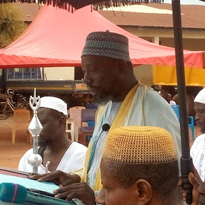 Mr Kumi, Alhaji Seidu slaughtering a sheep and the Muslim believers praying