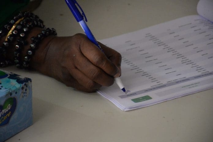 A voter registers at a polling station in Dakar, Senegal, on July 31, 2022. Senegal kicked off legislative elections at 8 a.m. Sunday (local time and GMT) to elect 165 new deputies to the National Assembly for a five-year term across national territory and abroad. (Photo by Dieylani Seydi/Xinhua)