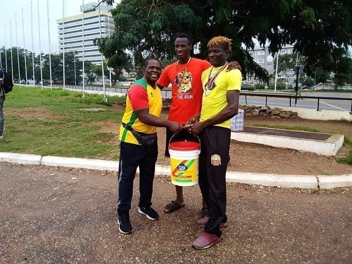 Boxers Present Paint To Wisdom Boxing Gym