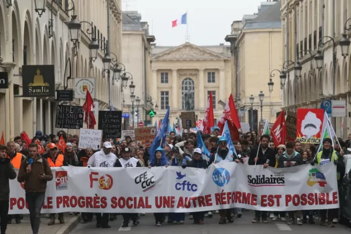 French Workers Hold Banner During Two Day General Strike