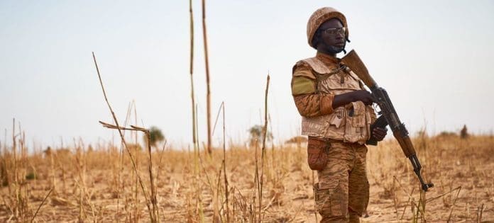 © Michele Cattani A soldier from Burkina Faso stands guard along the border with Mali and Niger during a military operation against terrorist suspects.