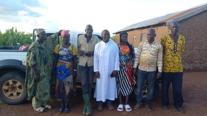 Aisha and representatives of the Diocese 