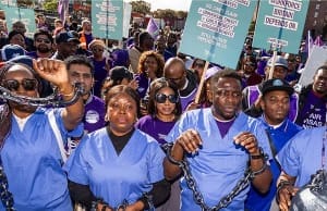 UK migrant care workers sing Asa’s ‘Jailer’ in chains